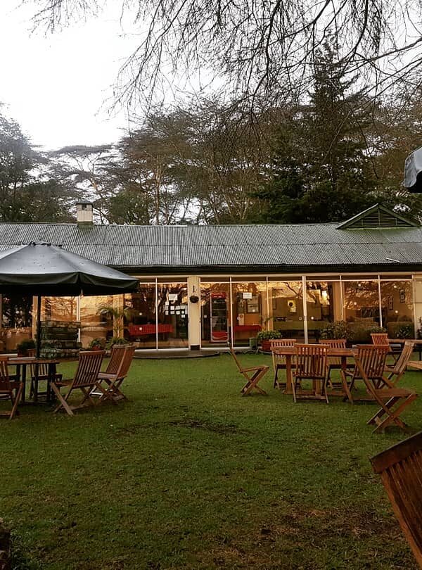 Outdoor garden dining area at Elsamere Conservation Centre, Lake Naivasha