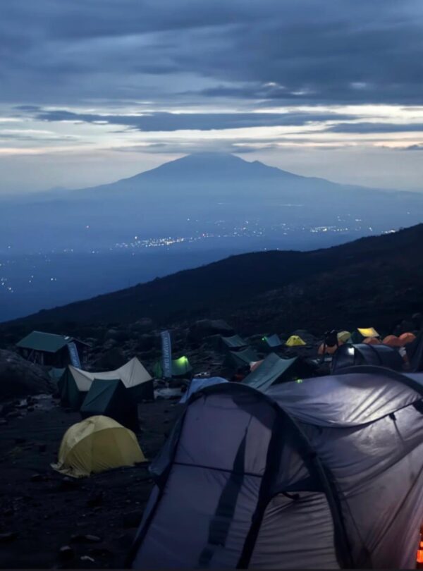 Tents on Mount Kilimanjaro Marangu Route at sunrise with mountain view Tanzania trekking safari
