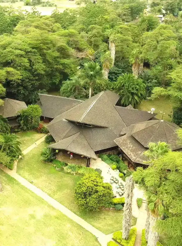 Aerial view of Ol Tukai Lodge Amboseli surrounded by lush acacia trees and gardens