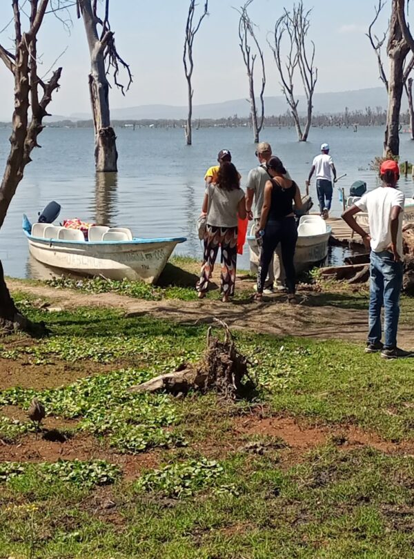 Guests boarding a boat along the lakeshore during a guided lake excursion