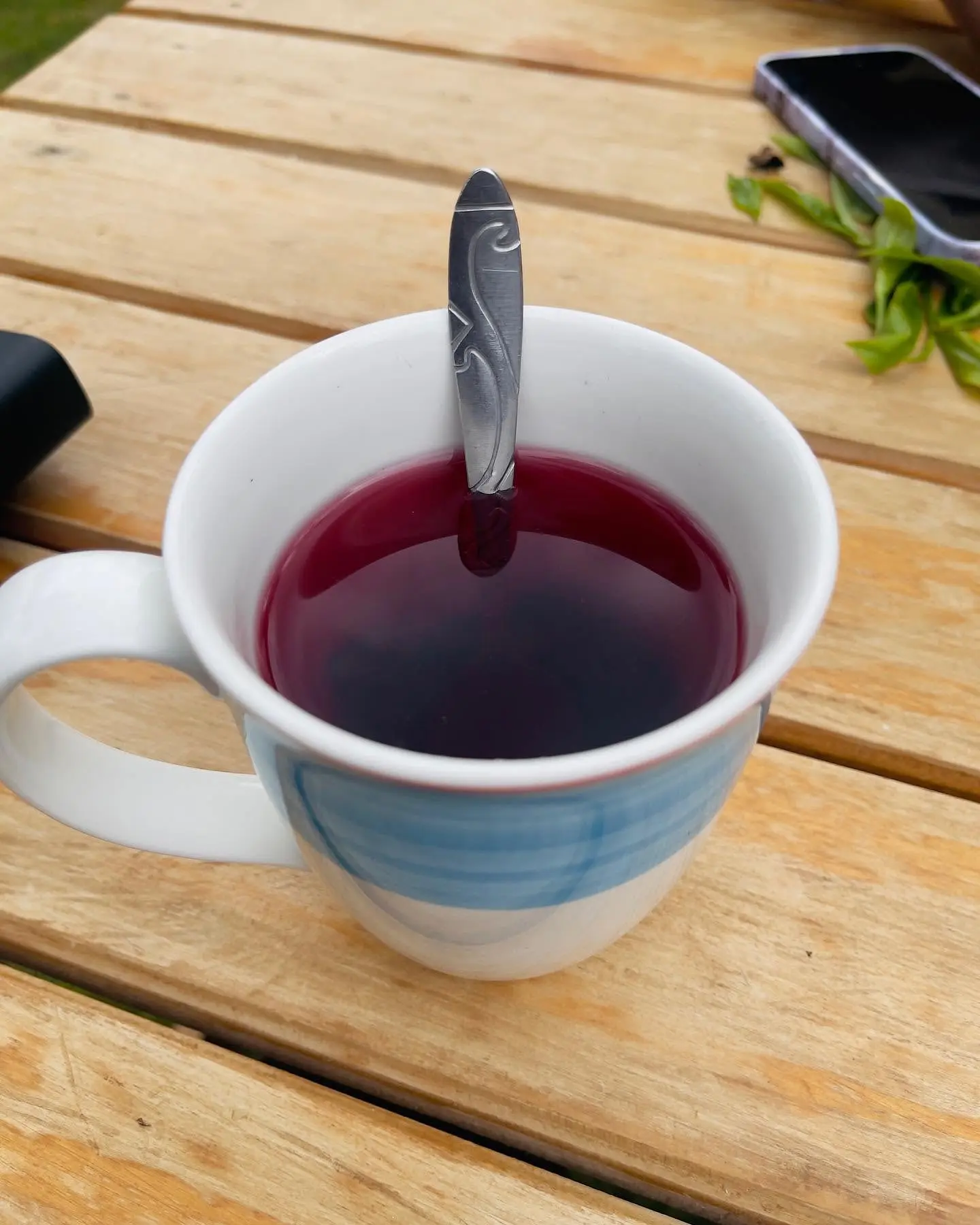 Cup of brewed purple tea at Gatura Greens tea farm in Kenya