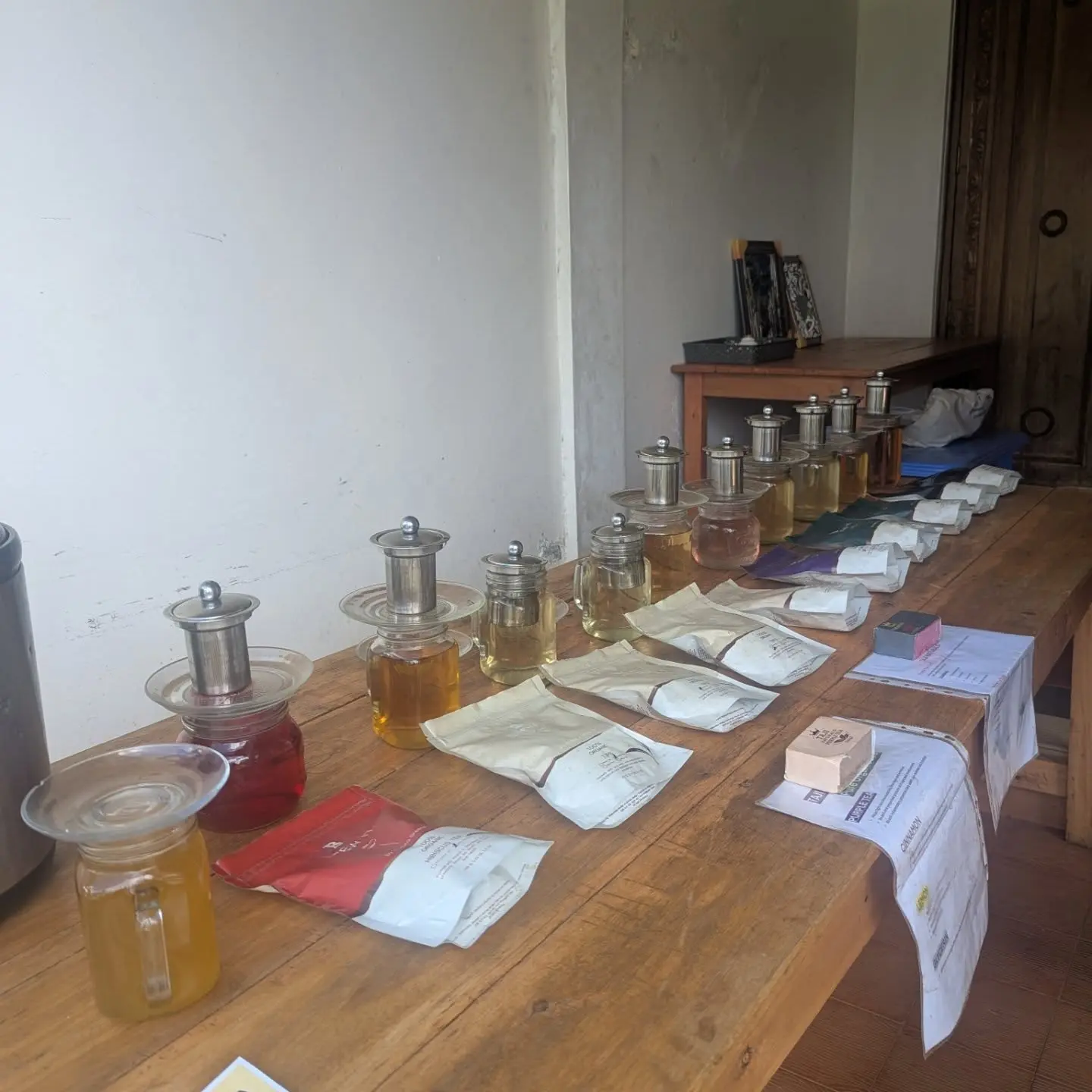 Tea tasting setup with purple, green and black teas at Gatura Greens in Kenya
