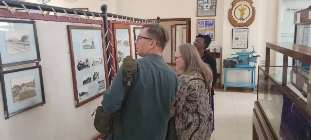 Visitors viewing historical exhibits at the Nairobi Railway Museum during a Nairobi museums day tour