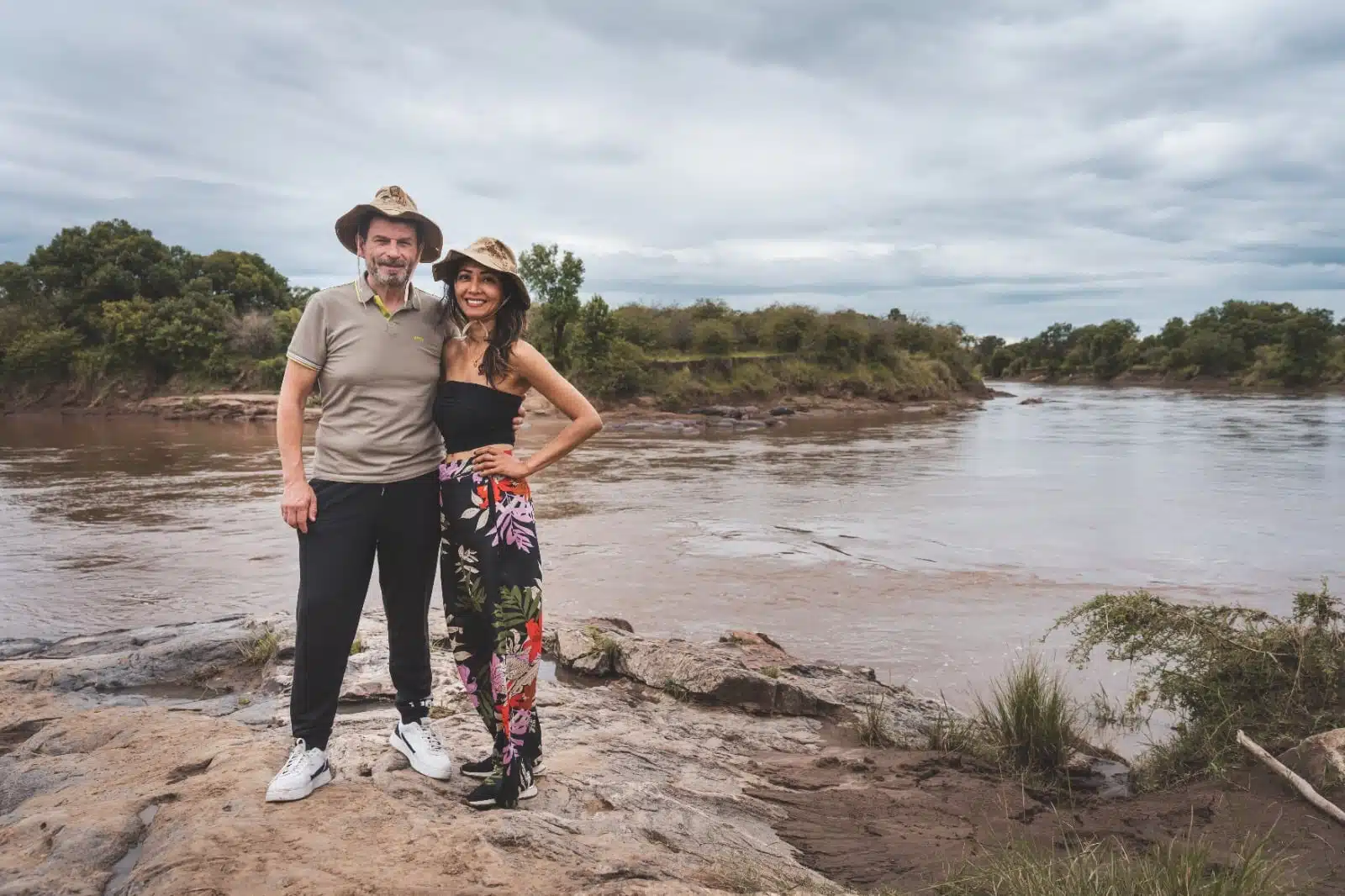 Gemfinders Safaris Guests at riverbank in Masai Mara during Kenya safari