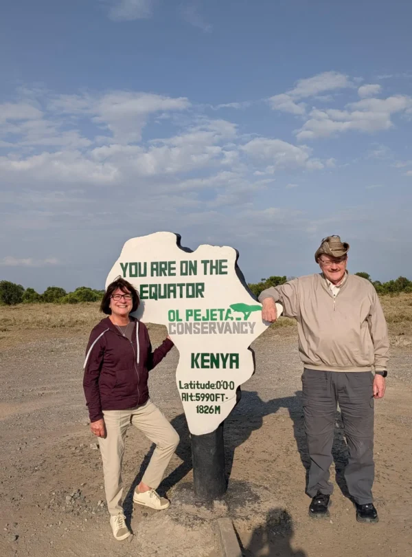 Travellers at the Equator marker in Ol Pejeta Conservancy, Kenya