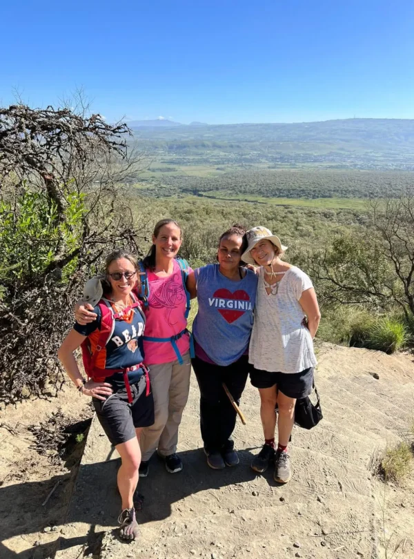Hikers pausing on the Mount Longonot trail with Rift Valley views