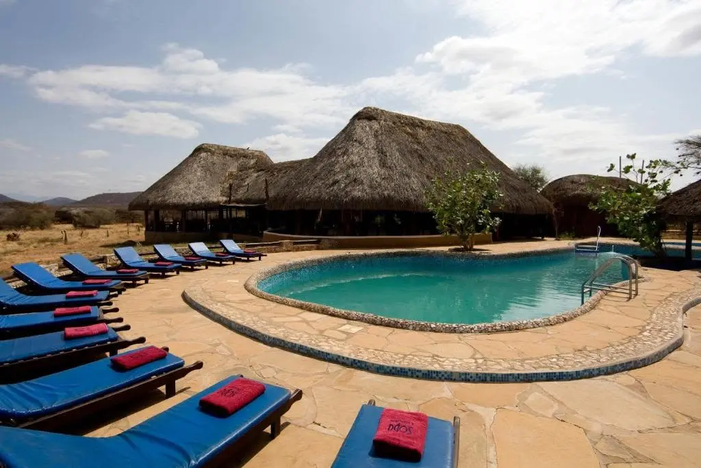 Swimming pool and thatched buildings at Samburu Sopa Lodge