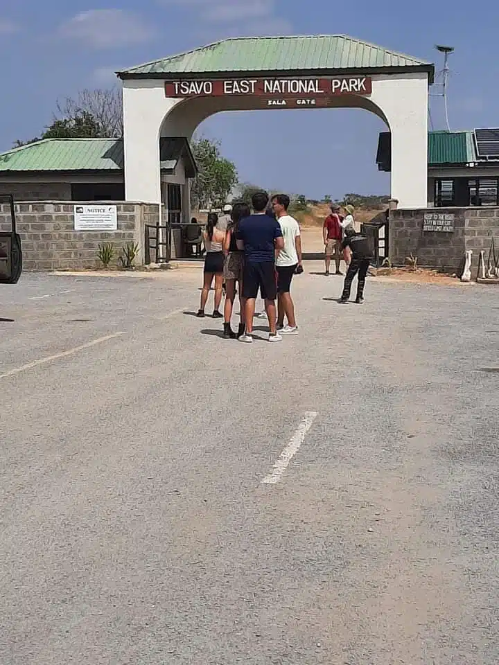 Tourists at Tsavo East National Park entrance gate during Kenya safari