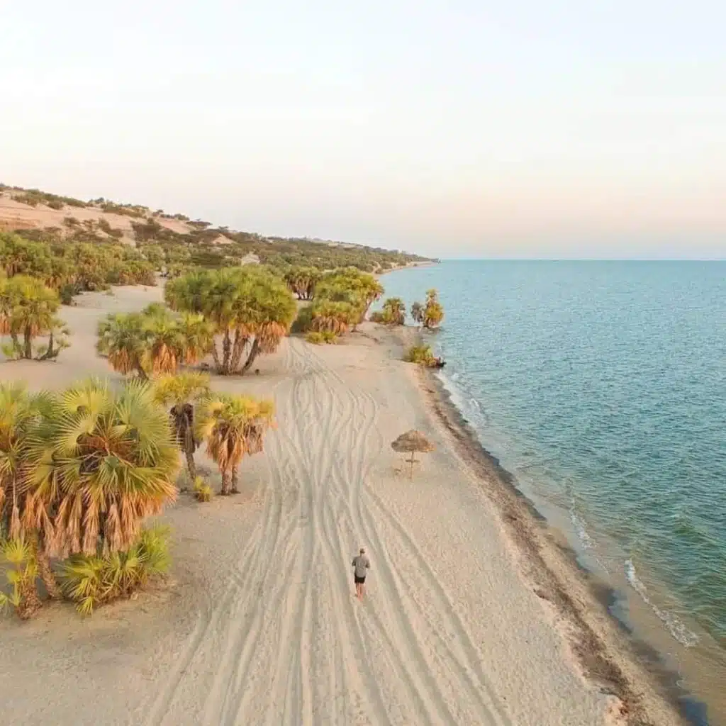 a-traveler-walks-on-the-shores-of-lake-turkana