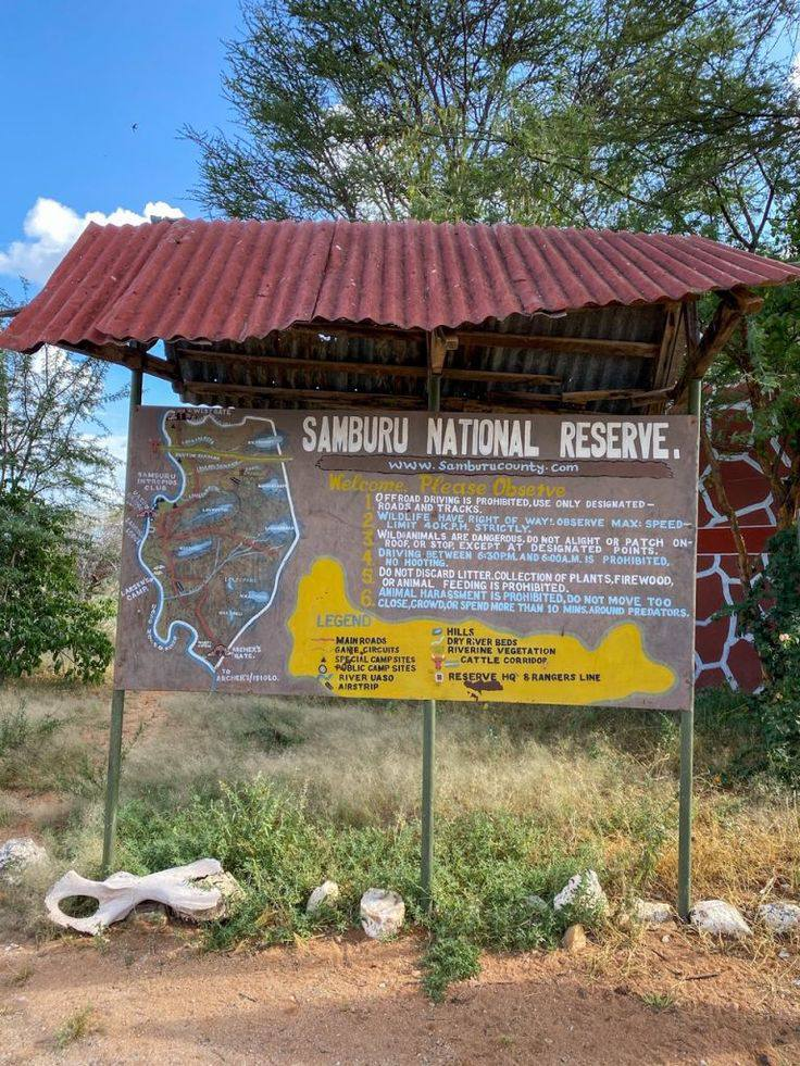 Information board at Samburu National Reserve with map and visitor guidelines.