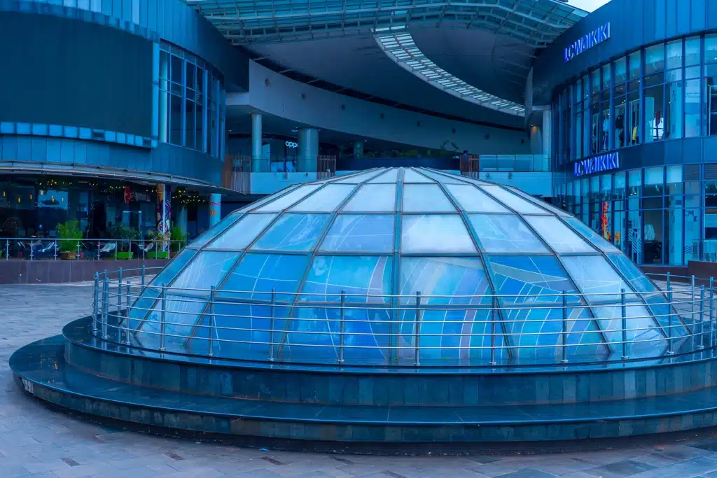 Glass dome structure at Two Rivers Mall in Nairobi surrounded by modern shops and restaurants.