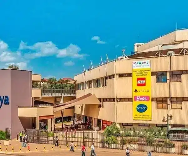 Yaya Centre Nairobi exterior featuring shops, cafes, and leisure spaces under clear blue skies.
