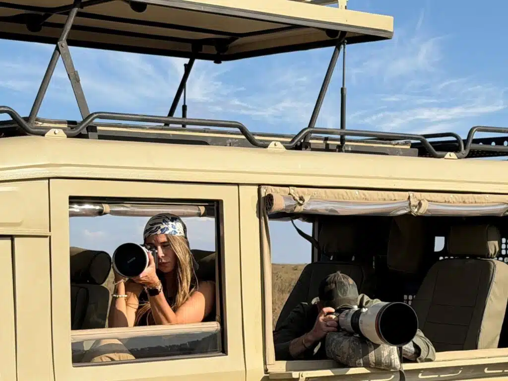 Wildlife photographers using long lenses from a private safari vehicle on a Gemfinders Safaris tour in Kenya.