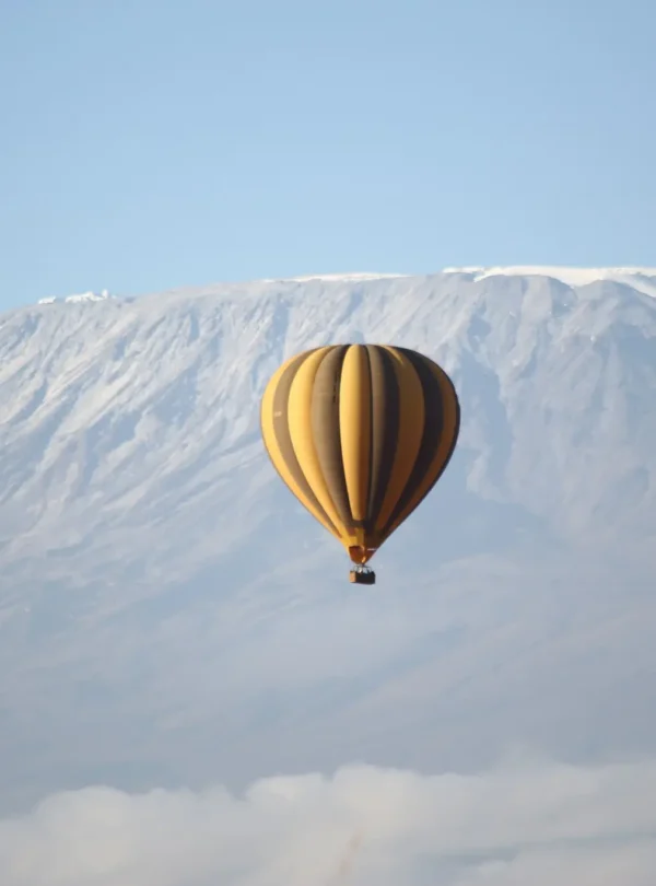 Hot air balloon over Amboseli with Kilimanjaro backdrop during a 6-Day Kenya Safari