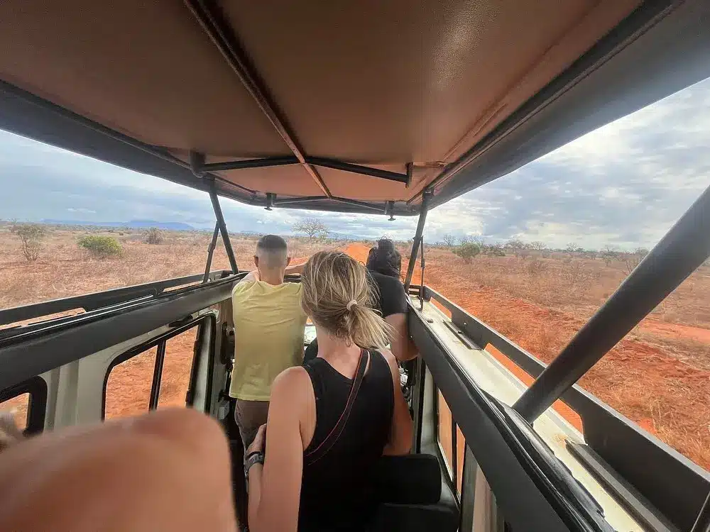 Travellers viewing wildlife from a pop-up roof in Tsavo East National Park