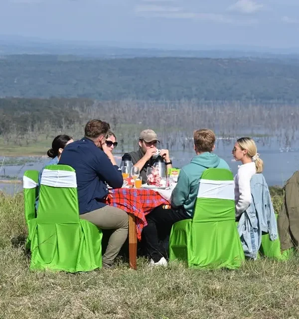 Guests enjoying lodge brunch overlooking Lake Nakuru in the Rift Valley