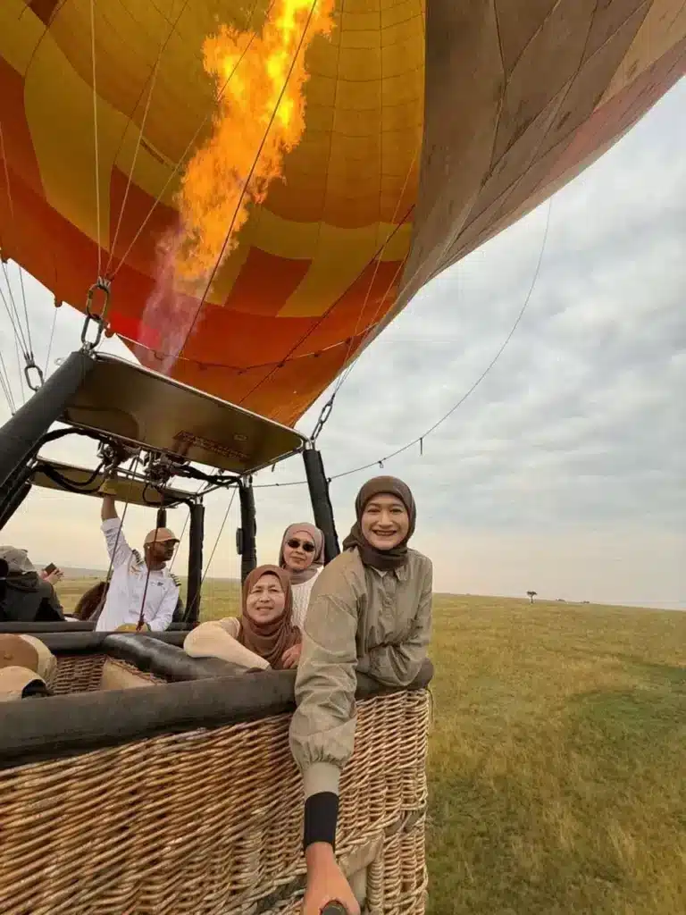Guests preparing for a hot-air balloon flight over the Masai Mara.