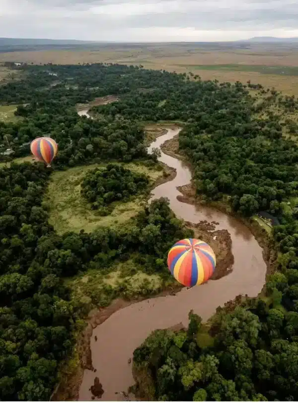 Balloon safari over the Mara River in Masai Mara, showing aerial views of plains and river systems.