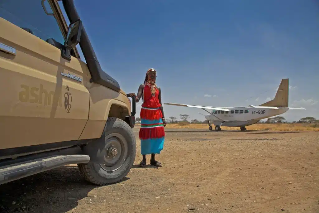 Light aircraft and safari cruiser at airstrip near Ashnil Samburu