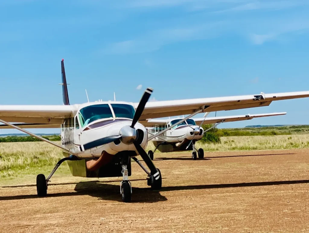 Safarilink bush planes parked at Masai Mara airstrip for guest transfers