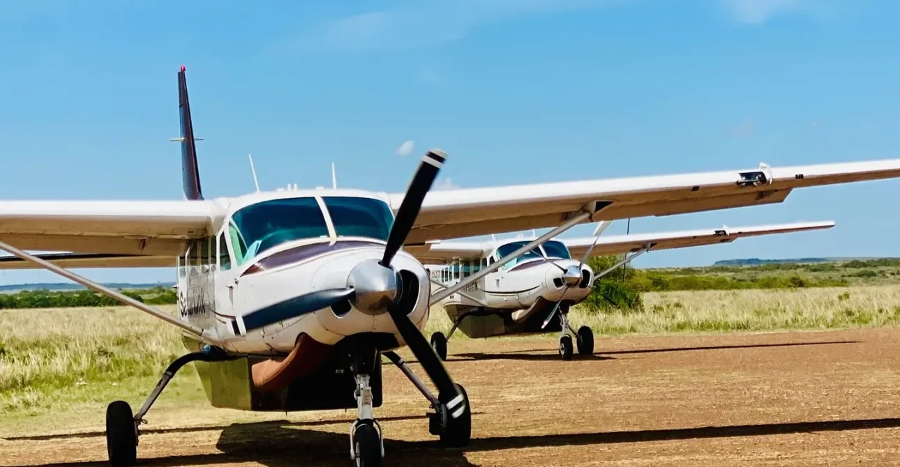 Safarilink bush planes parked at Masai Mara airstrip for guest transfers