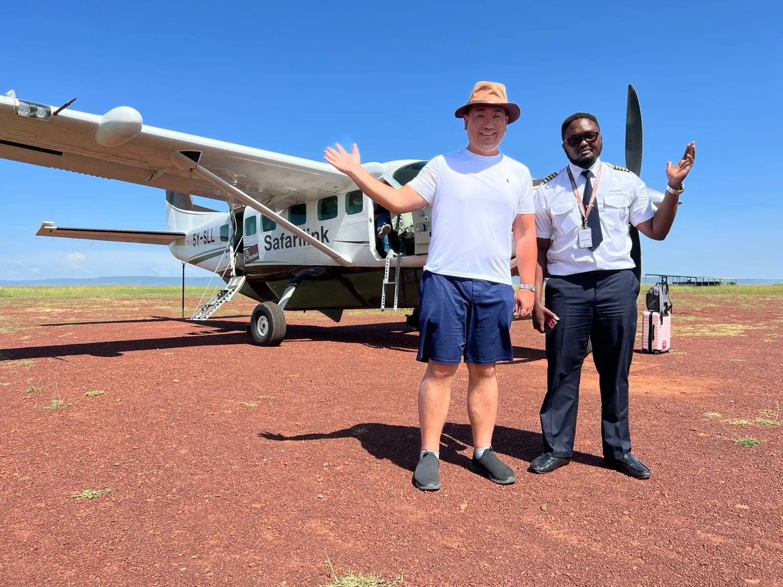 Safarilink bush flight arrival at Masai Mara airstrip with pilot ready for transfer