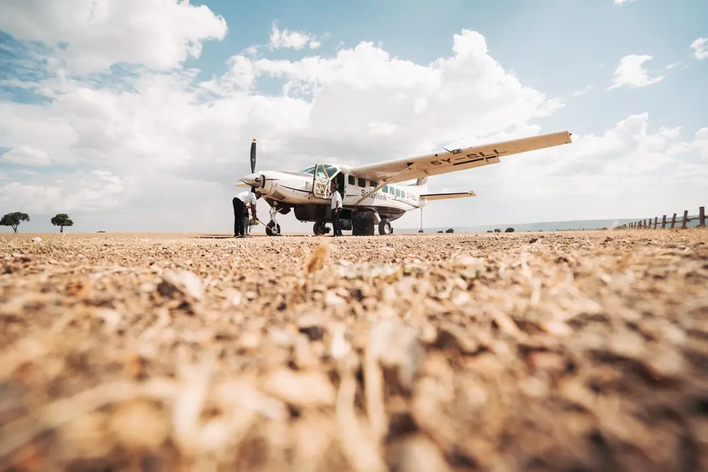 Safarilink aircraft on Masai Mara airstrip for scheduled bush flights from Nairobi