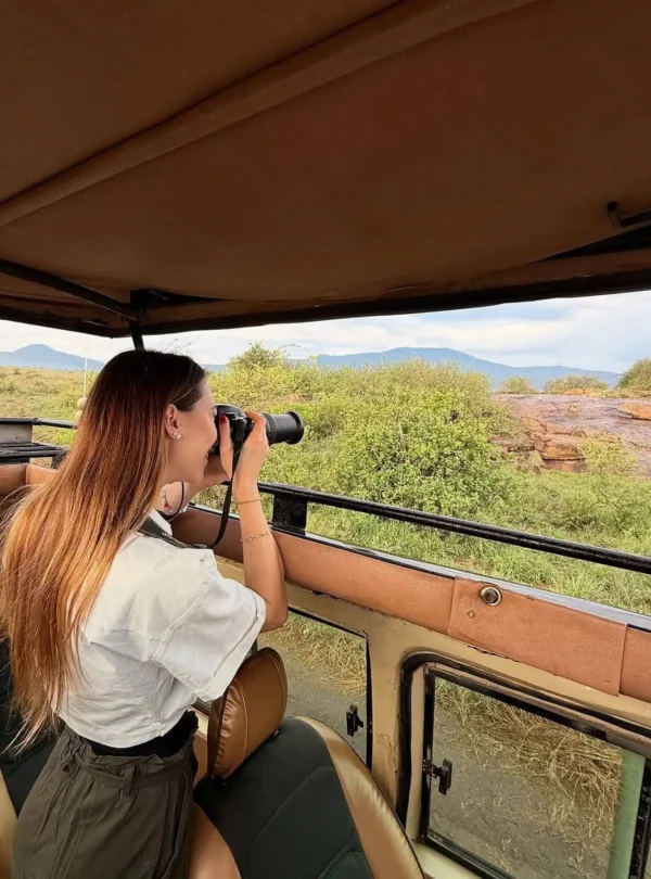 Guest spotting wildlife with binoculars
