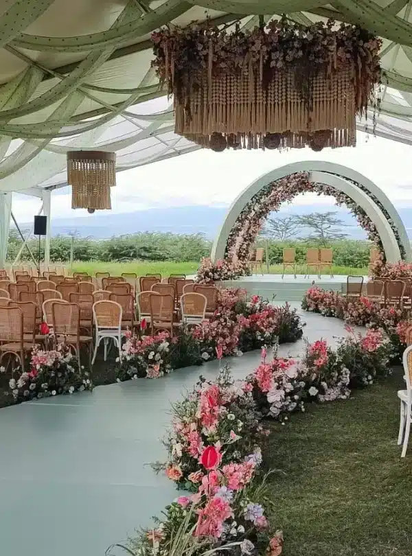 Elegant wedding ceremony at Ol Tukai Lodge with mountain views, a unique addition to a 10-Day Kenya Safari.