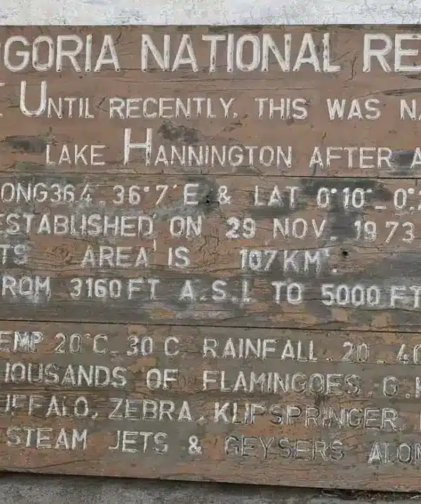 Historic signboard at Lake Bogoria National Reserve describing wildlife and geothermal features on a 7-Day Kenya safari.