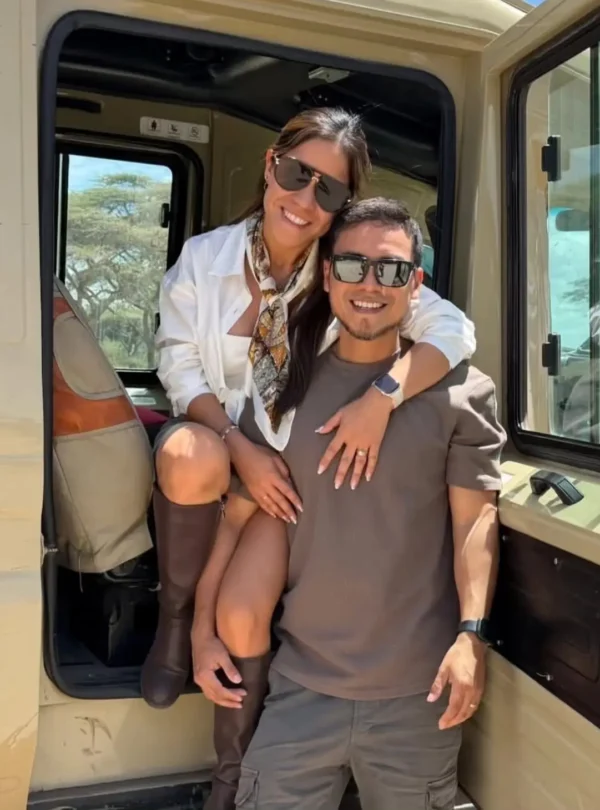 Couple posing in a safari vehicle during a Serengeti honeymoon safari