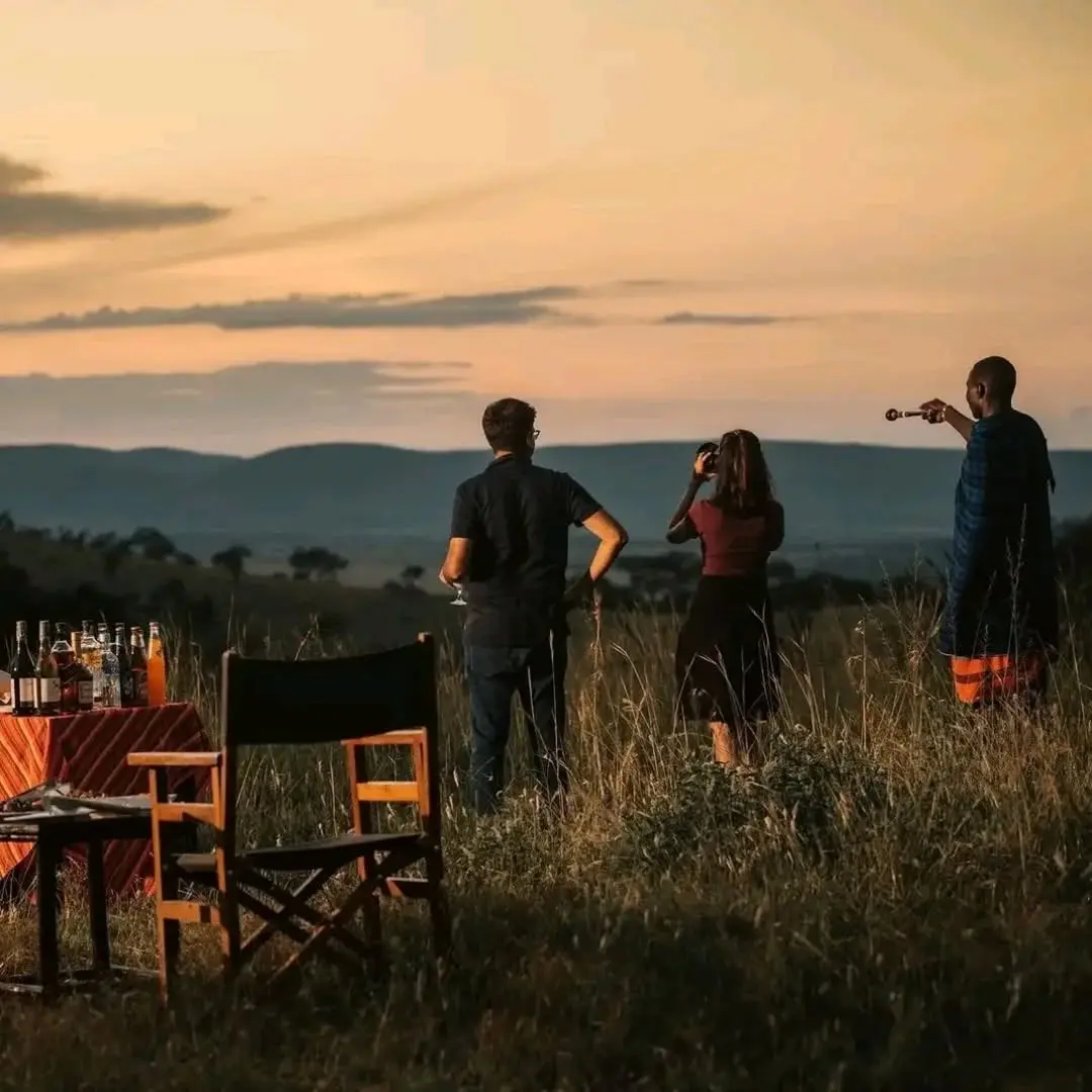 Couple enjoying a romantic sundowner experience during a Kenya honeymoon safari
